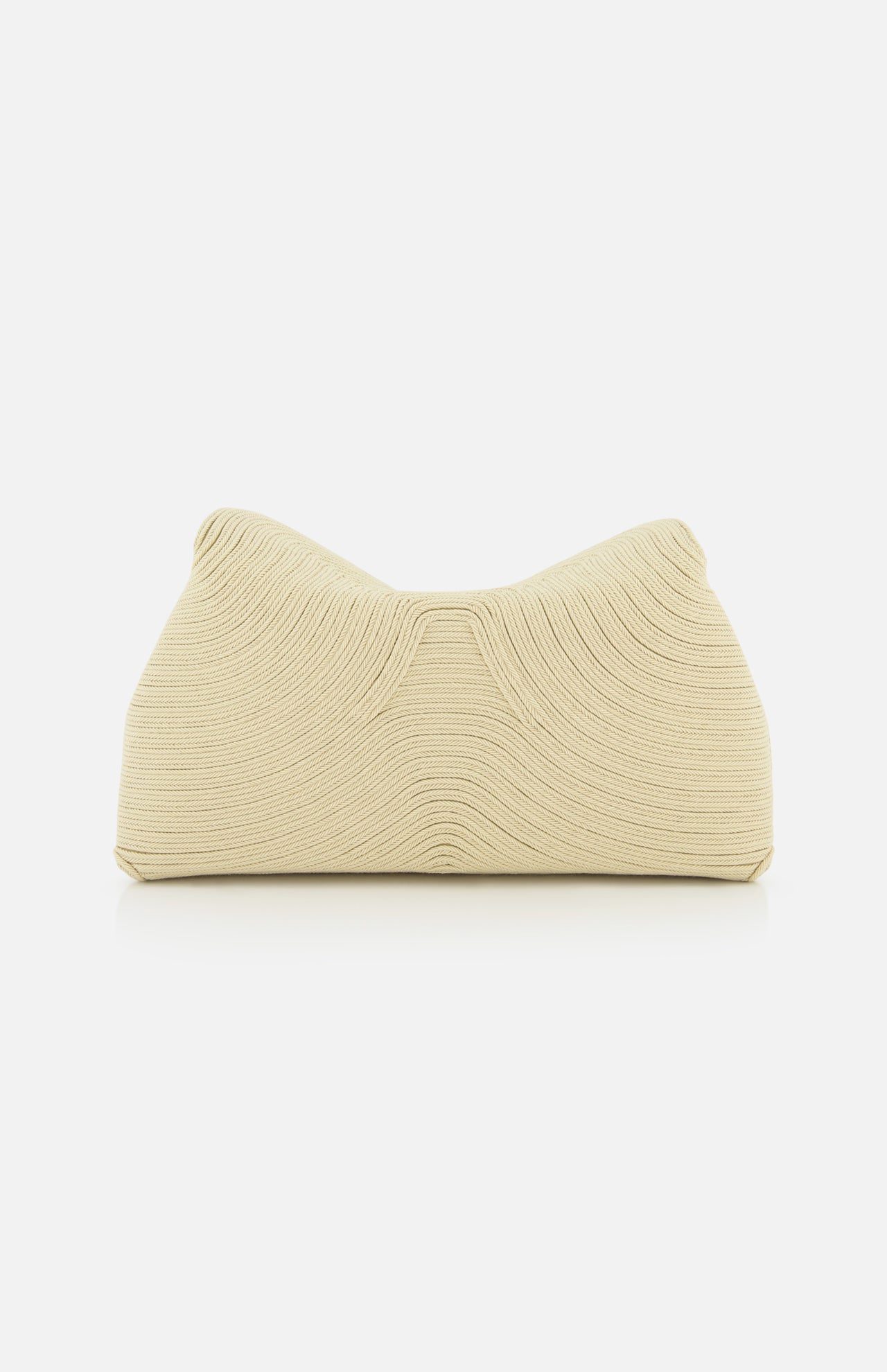 The TOTEME T-Lock Rope Clutch is a cream sculptural bag featuring a textured wave pattern and soft, structured shape, shown against a plain white background.