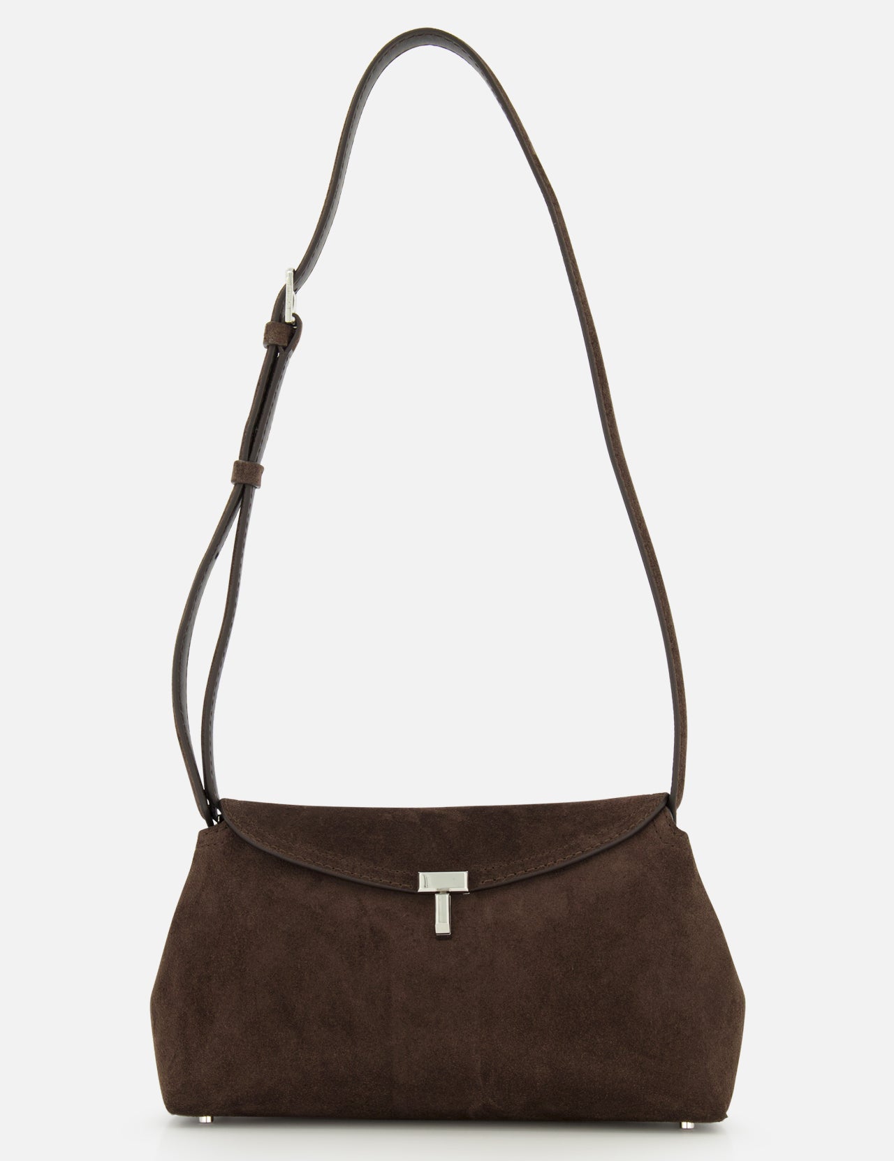 The TOTEME T-Lock Suede Clutch, crafted in chocolate brown suede with a long adjustable strap and finished with a silver clasp, made in Italy, is displayed on a plain white background.