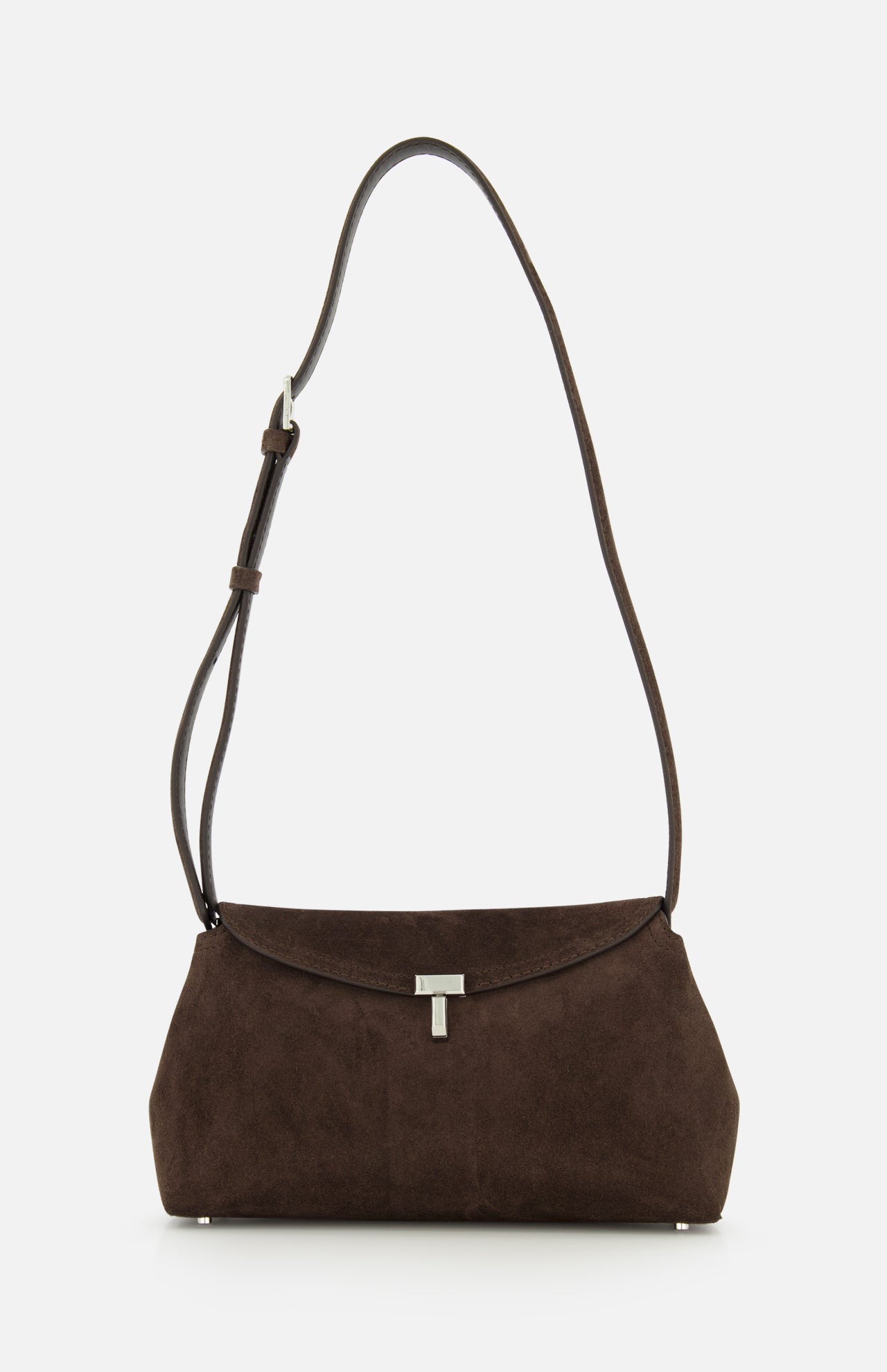 The TOTEME T-Lock Suede Clutch, crafted in chocolate brown suede with a long adjustable strap and finished with a silver clasp, made in Italy, is displayed on a plain white background.