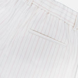 The Hudson St Trouser Pant by TWP features thin vertical red stripes on white, an elasticized waist, belt loops, and a single welt back pocket for a relaxed look.