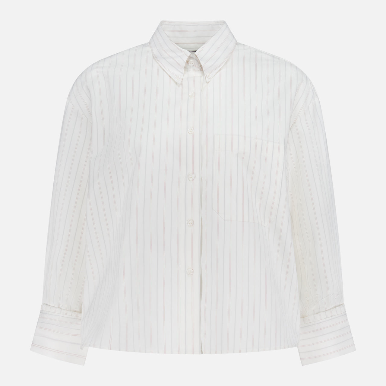 The TWP J.D. Shirt is a women’s white, long-sleeve top with thin vertical pastel stripes, a single chest pocket, and a pointed collar, shown on a plain white background.