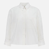 The TWP J.D. Shirt is a women’s white, long-sleeve top with thin vertical pastel stripes, a single chest pocket, and a pointed collar, shown on a plain white background.