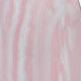 A close-up of TWP's Striped A-Line Skirt shows thin vertical red and blue stripes on white, evoking classic nautical style—an ideal pick for women's workwear paired with a crisp blouse.