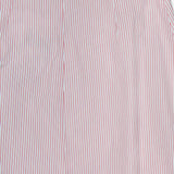 Close-up of TWP’s Striped A-Line Skirt shows smooth fabric with thin red and white vertical pinstripes and subtle pleats near the top, giving a classic, nautical-inspired look ideal for women’s workwear or everyday style.