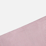 The Striped A-Line Skirt by TWP features bold diagonal red and green stripes on white, creating a striking contrast with its plain white sections and channeling classic nautical-inspired style.