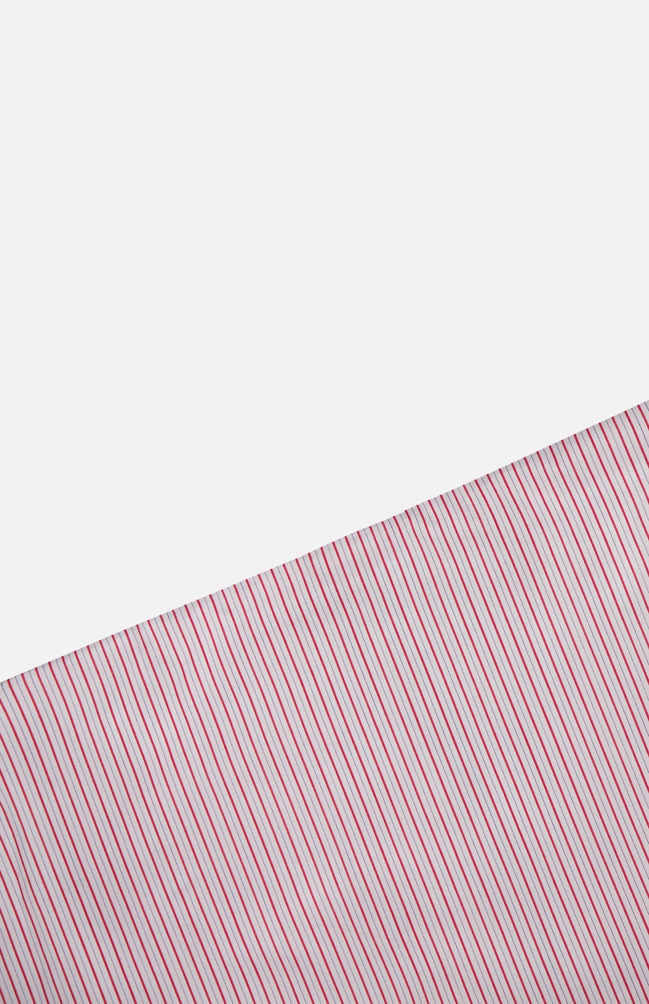 The Striped A-Line Skirt by TWP features bold diagonal red and green stripes on white, creating a striking contrast with its plain white sections and channeling classic nautical-inspired style.