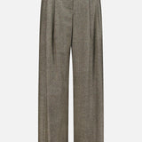 The Avery Herringbone Wide Leg Trouser by TWP showcases high-waisted, wide-leg gray cashmere wool pants with front pleats and belt loops, elegantly presented against a plain white background—an elevated interpretation of classic women’s workwear.