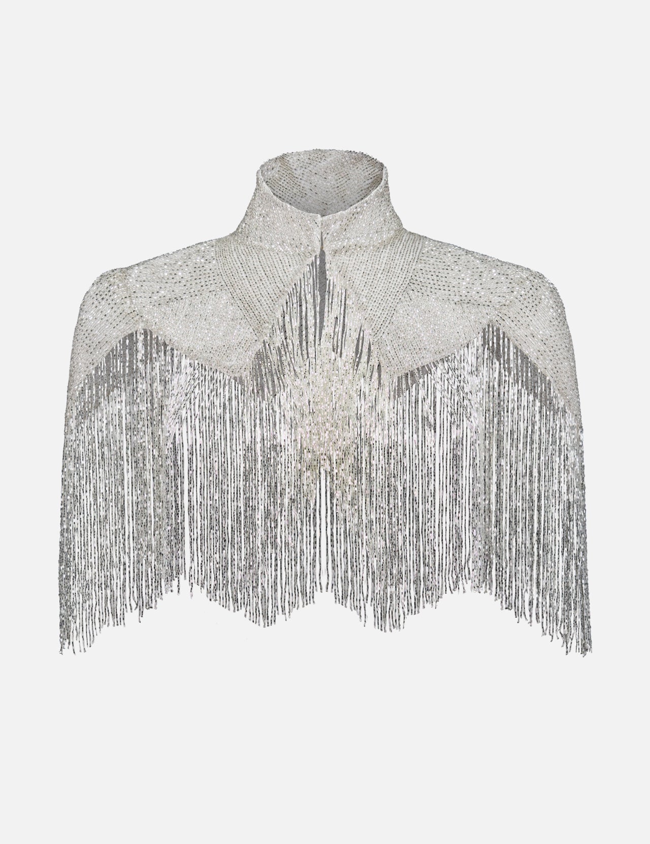 The TWP Beaded Silk Topper features a silver high collar, sparkling rhinestones, and long fringe for a dramatic effect. This glamorous capelet is displayed on a plain white background.