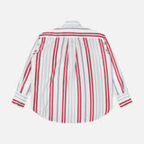 The Big Joe Oversized Shirt by TWP is a menswear-inspired, long-sleeve button-up with a white base and vertical red and blue stripes, shown flat with the back facing up.