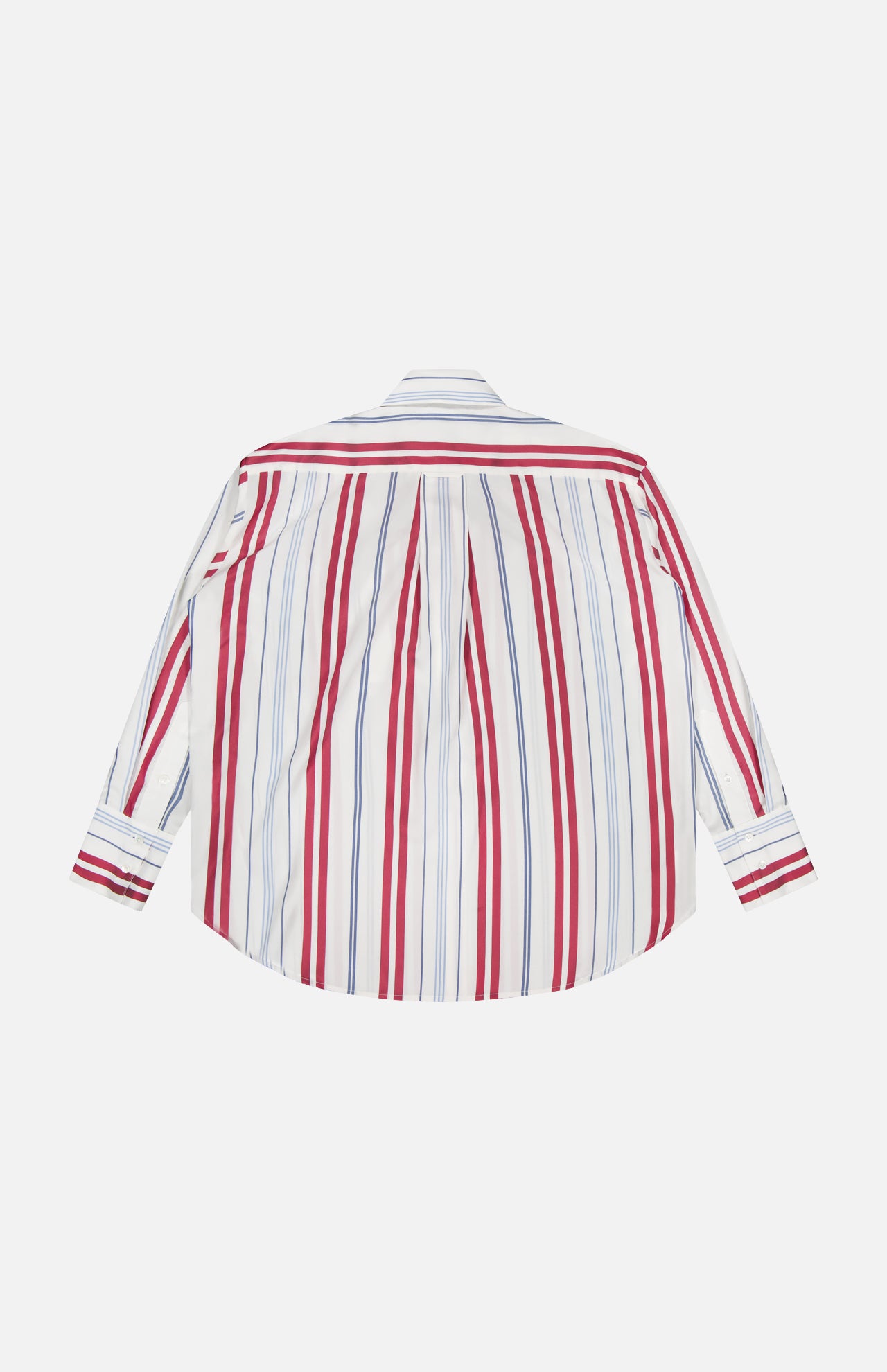 The Big Joe Oversized Shirt by TWP is a menswear-inspired, long-sleeve button-up with a white base and vertical red and blue stripes, shown flat with the back facing up.