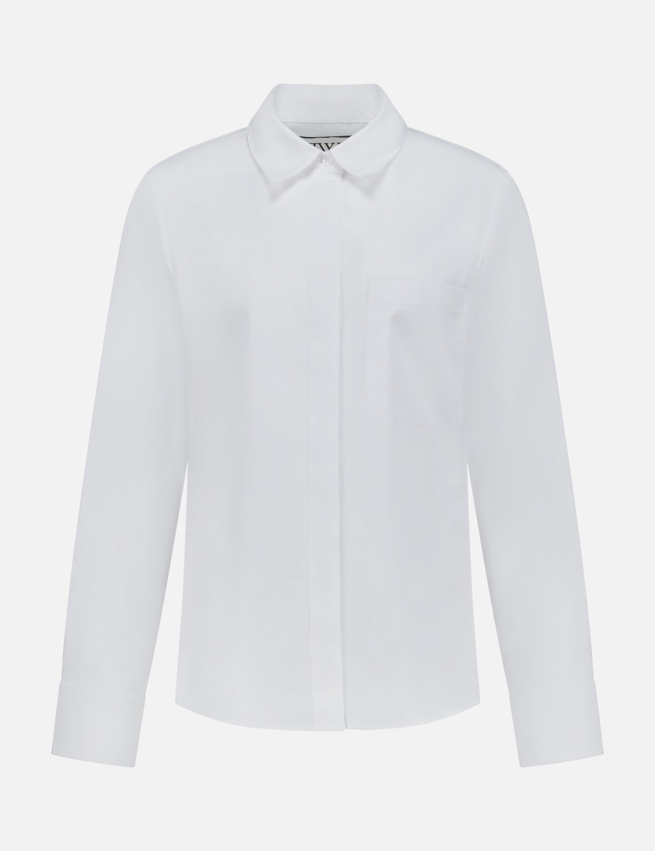 The Cowboy Update Relaxed Fit Shirt by TWP is a classic white button-down with long sleeves, a collar, and a single chest pocket, displayed on a white background—perfect for women seeking timeless style and versatile workwear.