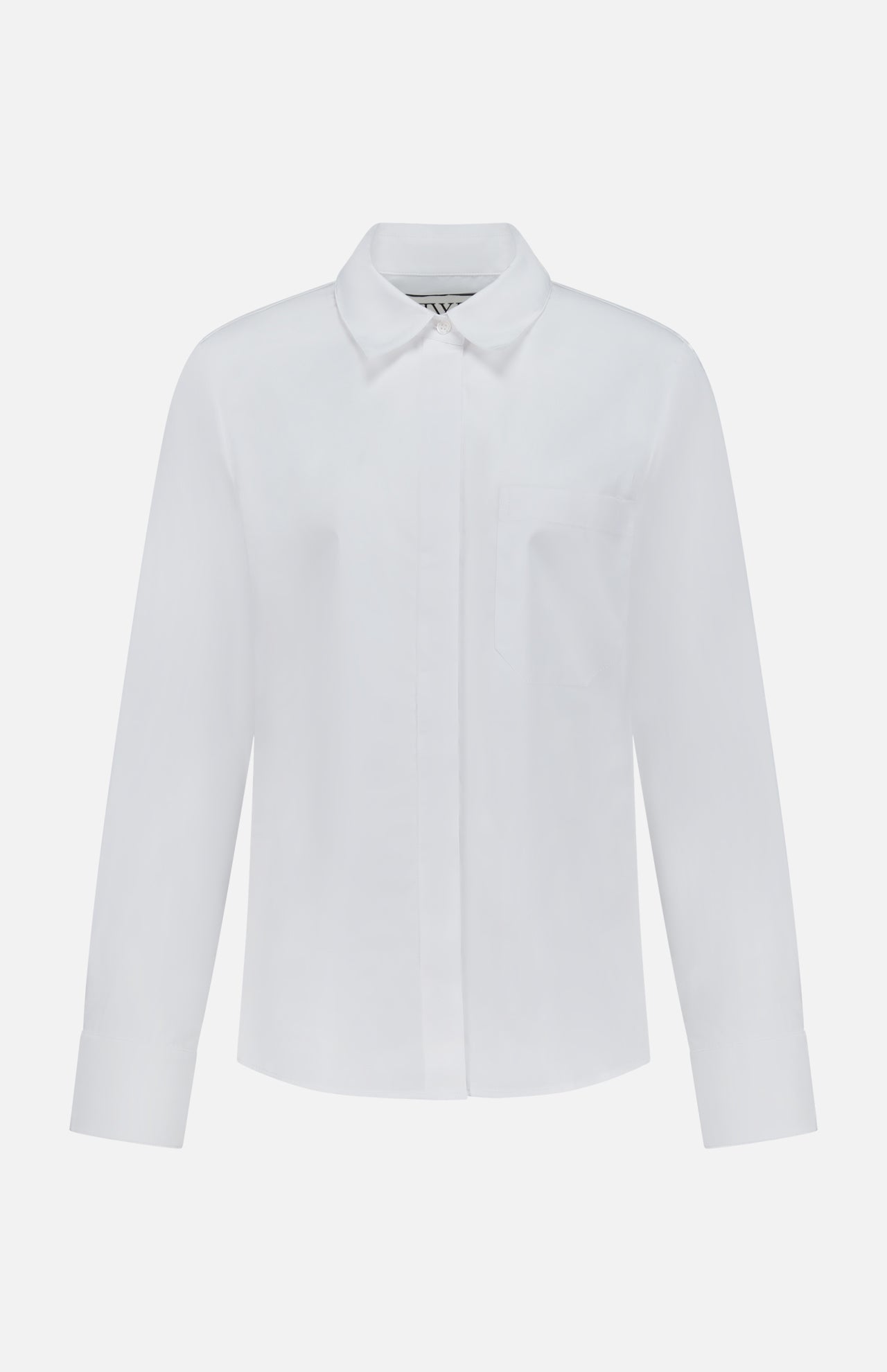 The Cowboy Update Relaxed Fit Shirt by TWP is a classic white button-down with long sleeves, a collar, and a single chest pocket, displayed on a white background—perfect for women seeking timeless style and versatile workwear.