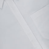 Close-up of TWP's Cowboy Update Relaxed Fit Shirt—a crisp, white button-down with a pointed collar and chest pocket, neatly pressed and lying flat—a timeless staple in women’s workwear.