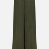 The Demie Wide Leg Trouser Pant by TWP is a high-waisted, wide-leg design in dark green, crafted from a viscose linen blend with front seams, side pockets, and a minimalistic aesthetic, shown against a plain white background.