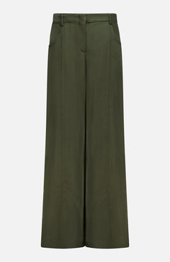 The Demie Wide Leg Trouser Pant by TWP is a high-waisted, wide-leg design in dark green, crafted from a viscose linen blend with front seams, side pockets, and a minimalistic aesthetic, shown against a plain white background.