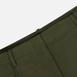 Close-up of the TWP Demie Wide Leg Trouser Pant in dark green, highlighting the waistband, belt loops, and a portion of the front pocket against a plain background. Made from a soft viscose linen blend, these wide-leg trousers combine comfort with workwear-inspired style.