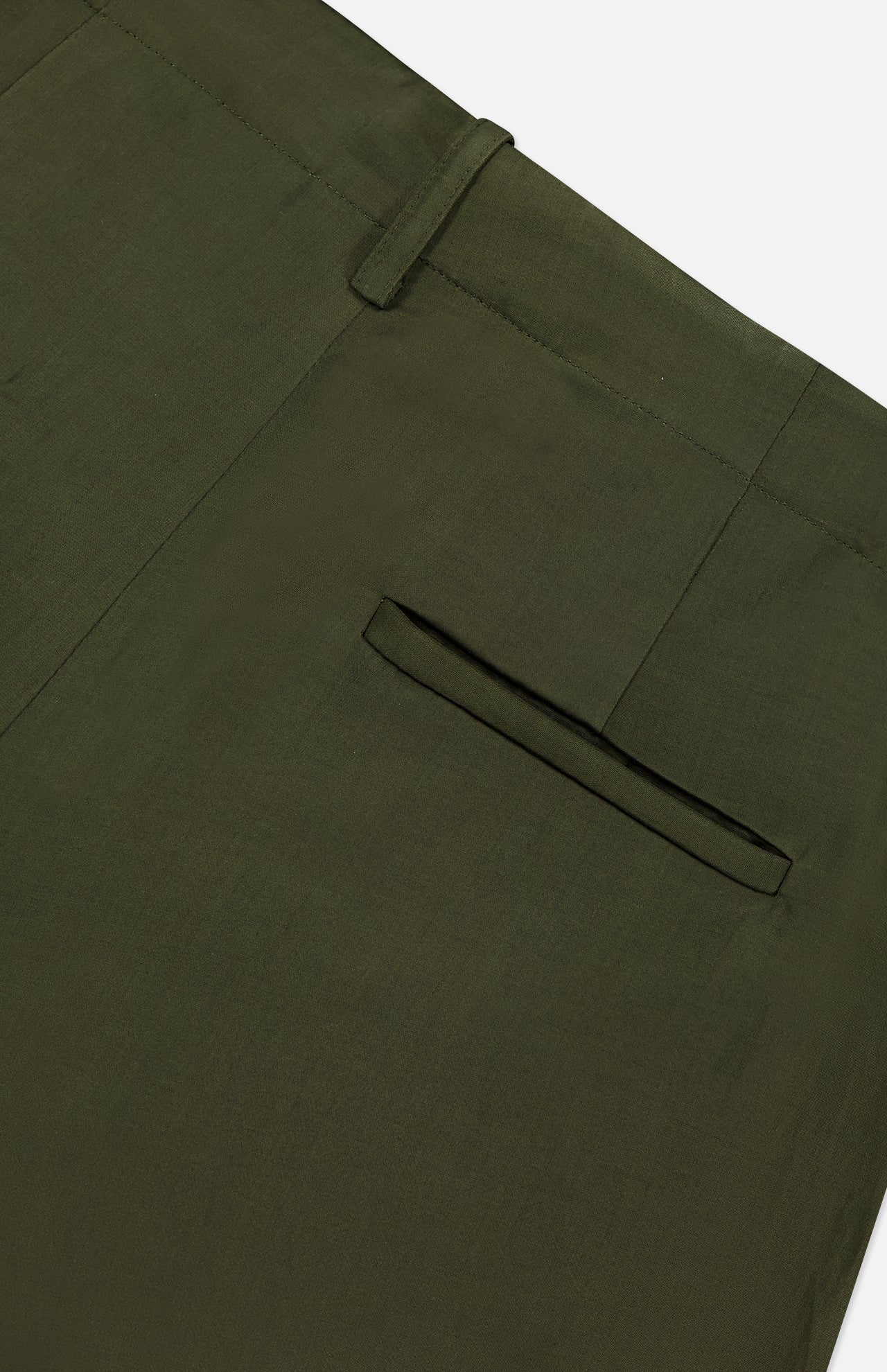 Close-up of the back pocket and waistband of the TWP Demie Wide Leg Trouser Pant in dark green, expertly crafted from a soft viscose linen blend. The image highlights a single welt pocket and belt loop, set against a plain white background—an ideal choice for those seeking refined wide-leg workwear.