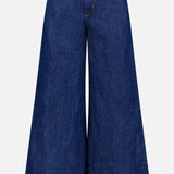 The TWP Dillon Denim Jeans in Dark Stone feature a high-rise, wide-leg silhouette with front button and zipper closure, two front pockets, and flared legs—an on-trend option for women's workwear.