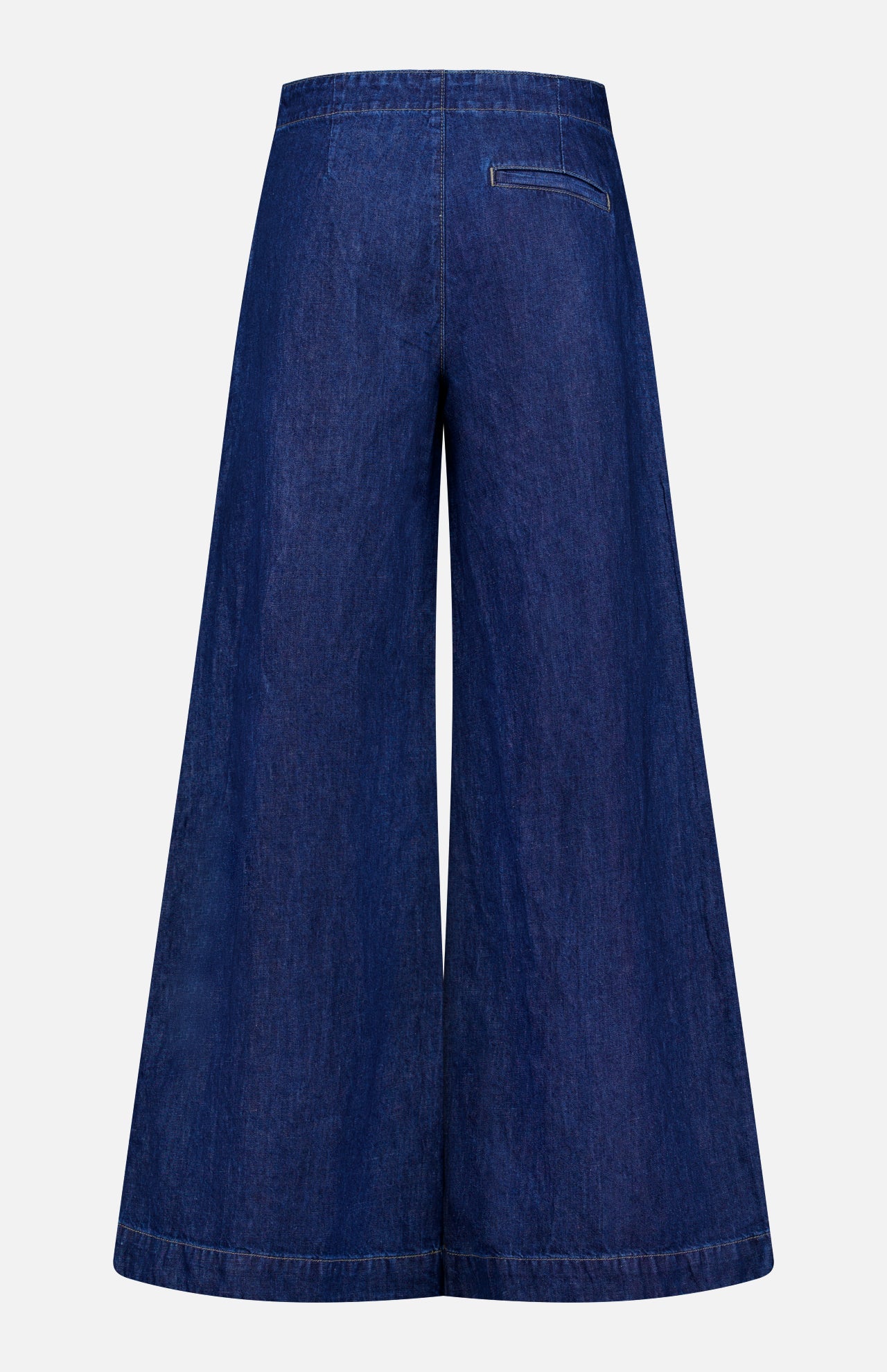 TWP Dillon Denim Jeans in Dark Stone—wide-leg, high-rise style with flared legs and a single right-side welt pocket. Shown from the back; ideal for elevating women’s workwear.