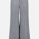 The TWP Dillon Glossy Stripe Pants feature a wide-leg, high-rise fit with front pockets, belt loops, and a subtle vertical texture for a chic, professional look and flared silhouette—perfect tailored workwear for women.