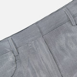 Close-up of TWP Dillon Glossy Stripe Pants in blue and white vertical stripes, featuring belt loops, a pocket, and a waistband—these high-rise wide-leg pants are an ideal choice for stylish women's workwear.
