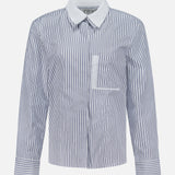 The TWP Double Layer Boyfriend Shirt is a women's long-sleeve workwear top featuring blue and white vertical stripes, a crisp white pointed collar, a chest pocket, and matching striped cuffs, displayed on a plain white background.