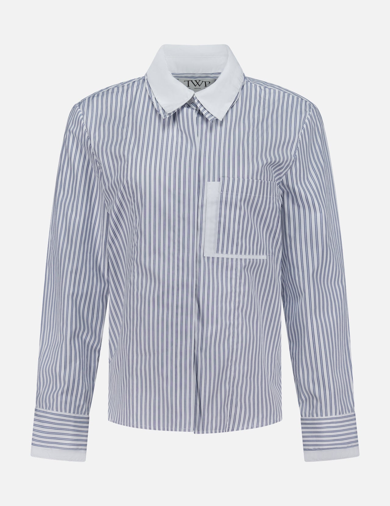 The TWP Double Layer Boyfriend Shirt is a women's long-sleeve workwear top featuring blue and white vertical stripes, a crisp white pointed collar, a chest pocket, and matching striped cuffs, displayed on a plain white background.