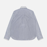 The Double Layer Boyfriend Shirt by TWP is displayed from the back, showcasing its blue and white vertical stripes with a crisp white collar and cuffs that evoke the look of a classic dress shirt, set against a plain light background.