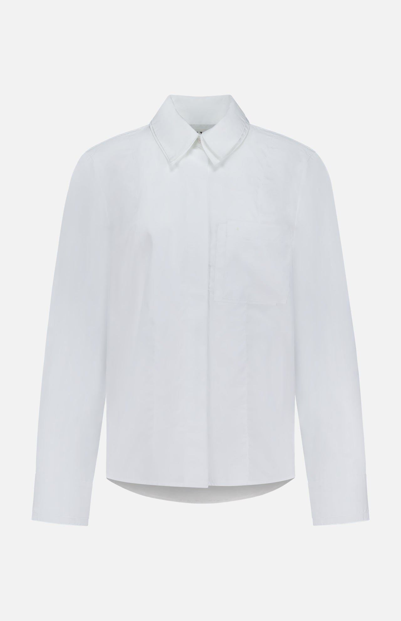 TWP's Double Layer Boyfriend Shirt—a white long-sleeve button-up with a pointed collar, front pocket, and minimalist, clean design—offers the perfect workwear option for women and is displayed against a plain white background.