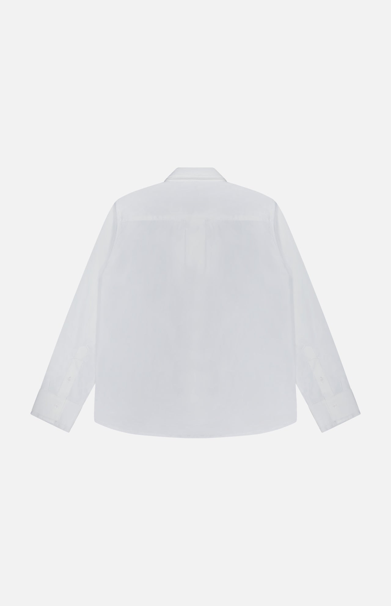 The image displays the Double Layer Boyfriend Shirt by TWP from the back against a plain white background. This white, long-sleeve button-up shirt features a traditional collar and buttoned cuffs, offering timeless style and professionalism for women seeking classic workwear.