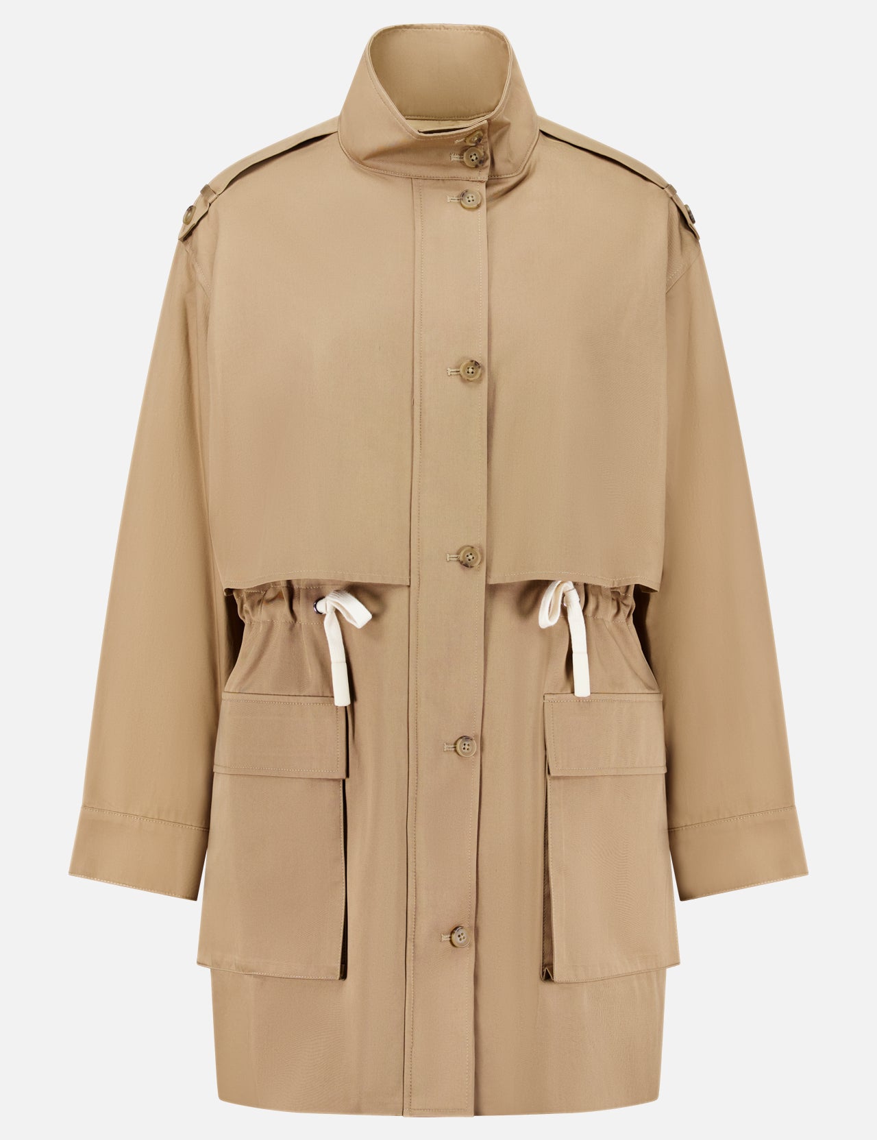 The Drawing Conclusions Jacket by TWP is a beige chino twill utility trench coat designed for women, featuring large front pockets, an adjustable waist drawstring, button-down front, and a high collar. This relaxed-fit workwear staple is finished with shoulder epaulets for a timeless utilitarian flair.