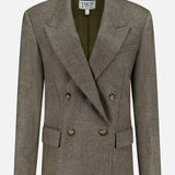 A double-breasted, olive-green wool blazer—the Harper Herringbone Blazer by TWP—features peaked lapels, four buttons, flap pockets, and a TWP label inside the collar, offering a sophisticated alternative to the classic women's grey blazer or herringbone workwear jacket.