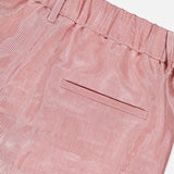 Close-up of TWP’s Henry St Stripe Short: red and white vertical stripes, pleated design, elastic waistband, belt loops, and a single back pocket with a horizontal opening.