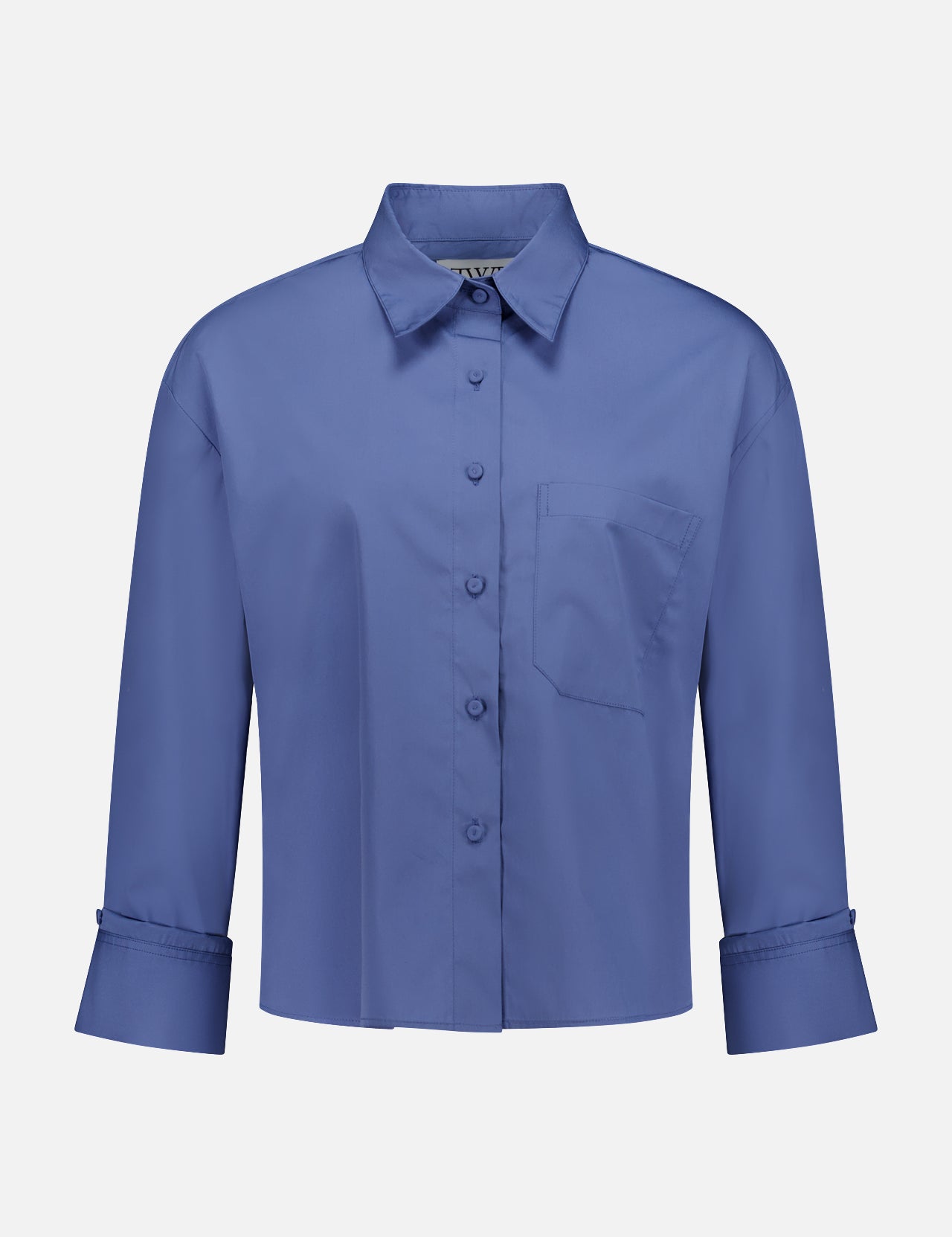 The TWP J.D.S Cropped Shirt is a women's boxy fit, long sleeve blue shirt with a collar, chest pocket, and wide cuffs, shown against a plain white background.