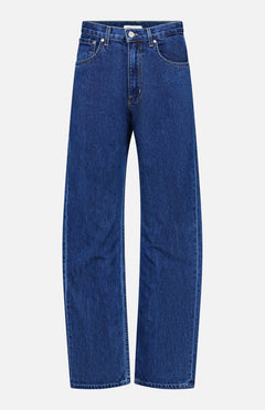 The TWP Kent St Jean in Dark Stone is a classic pair of women’s straight-leg blue jeans featuring front and back pockets and a button closure at the waist, displayed on a white background.