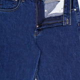 A pair of TWP Kent St Jean in Dark Stone women’s denim jeans is pictured with the zipper and button open, revealing the inside waistband and pocket label. These jeans showcase classic stitching, a straight leg silhouette, and a TWP brand tag on the inner waistband.