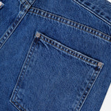 Close-up of the back pocket on the TWP Kent St Jean in Paris, highlighting intricate stitching details, a belt loop, and metal rivets at the pocket corners—a hallmark of this classic 5-pocket denim design.