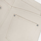 Close-up of the back pocket and waistband of the TWP Kent St Pant in Bone, highlighting stitching details and metal rivets against a plain white background.