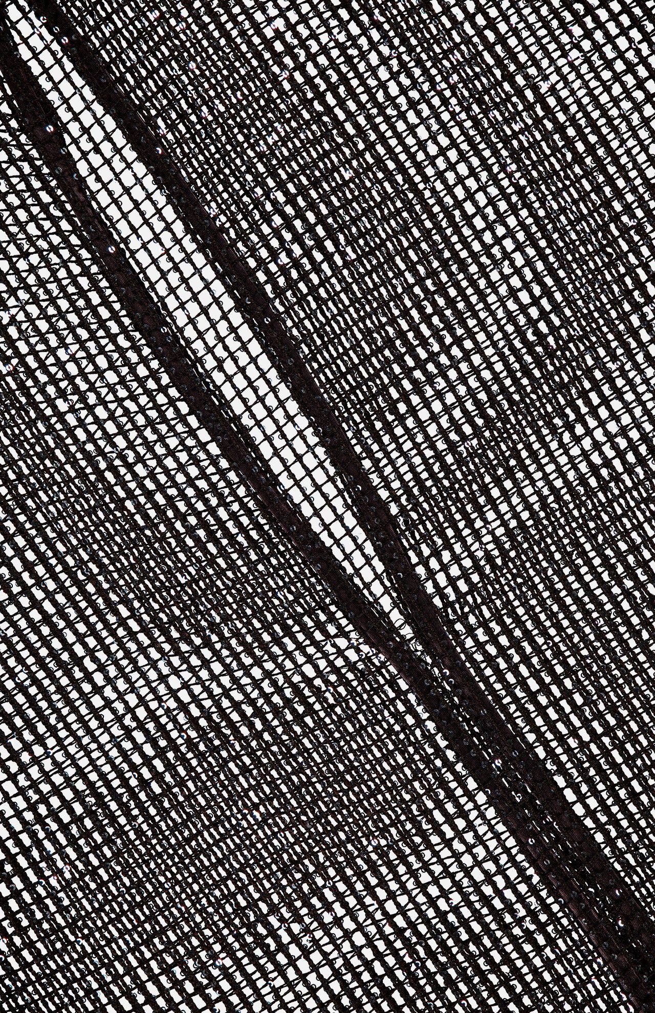 A close-up of the black mesh fabric on TWP's Sheer Sequin Muscle Tank, showing a diagonal seam and grid-like textured pattern against a white background.