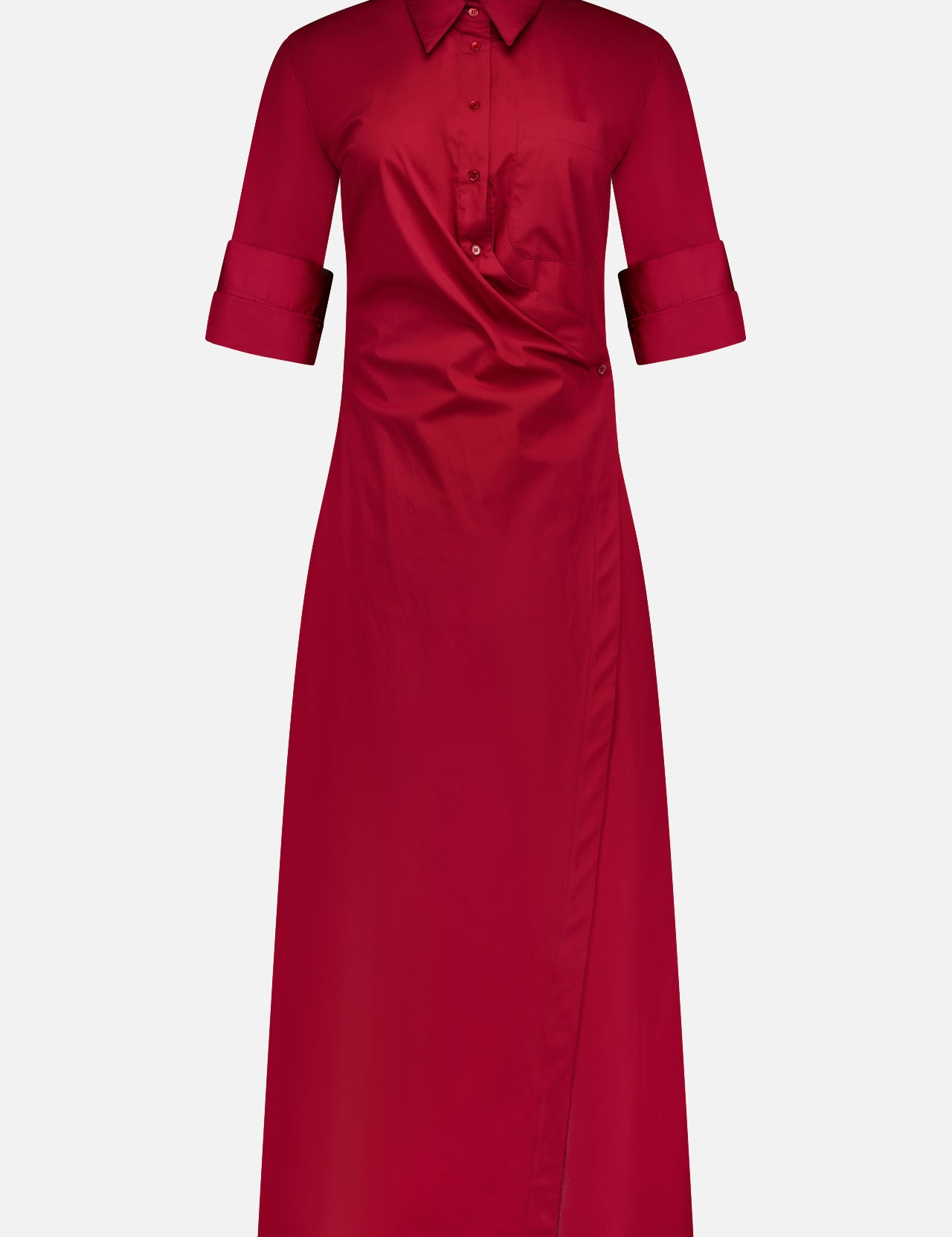 The TWP New Earl Wrap Front Dress is a knee-length, long-sleeve, red cotton shirt dress with a collared neckline, rolled cuffs, button-up front, and asymmetrical wrap style—ideal workwear for stylish, comfortable women.