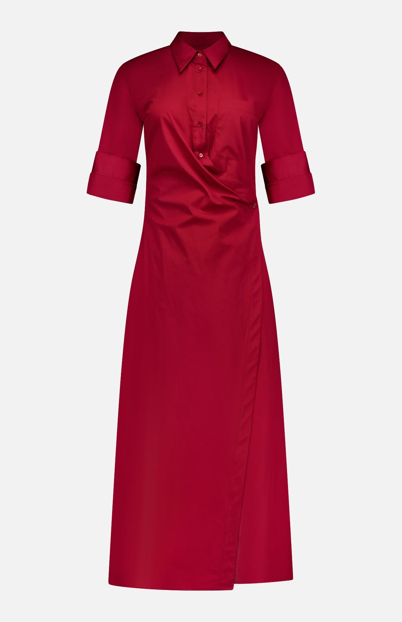 The TWP New Earl Wrap Front Dress is a knee-length, long-sleeve, red cotton shirt dress with a collared neckline, rolled cuffs, button-up front, and asymmetrical wrap style—ideal workwear for stylish, comfortable women.