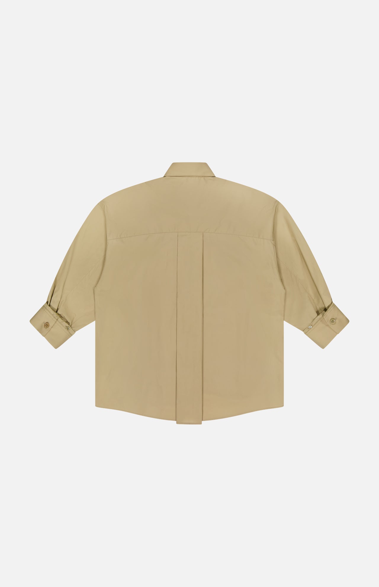 The TWP New Earl Asymmetric Button Front Shirt is a beige, long-sleeved Italian cotton shirt with buttoned cuffs and a central back seam, shown laid flat on a white background.