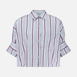 The Next Ex Striped Blouse by TWP is a cropped, boxy shirt featuring vertical red, black, and white stripes. Designed with short sleeves, a button-up front, collar, front pocket, and folded cuffs, this stylish piece is an ideal workwear option for women. Shown against a plain white background.