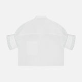 Back view of the TWP Next Ex Cropped Shirt—a boxy, white short-sleeve collared design—offers versatile workwear style for women. Shown against a plain white background.