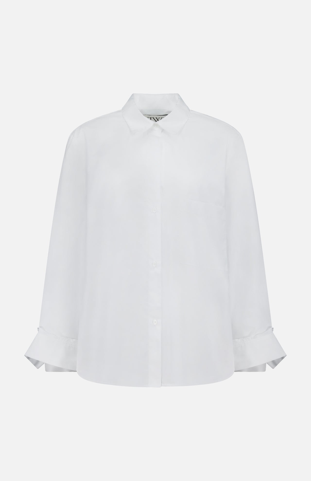 The TWP Next Morning Oversized Shirt is crafted from Italian cotton in white, with a classic collar and wide, folded cuffs—ideal for an office chic look. Shown on a plain white background.
