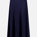 The TWP Seamed Maxi Skirt is a navy A-line piece with subtle vertical stitching, a flared hem, and a fitted waistband—making it a versatile workwear option for women. Shown on a plain white background.