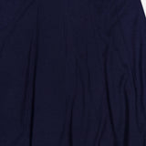 A close-up of the TWP Seamed Maxi Skirt in dark navy, highlighting its vertical seam detailing and tailored waistband against a plain background—an elegant and sophisticated workwear piece for women.
