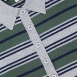Close-up of the TWP Short Sleeve Polo with Stripes, designed as modern women's workwear. The shirt showcases gray, green, and navy horizontal stripes and features a button placket. Inside the collar is a white TWP label with smaller text beneath.
