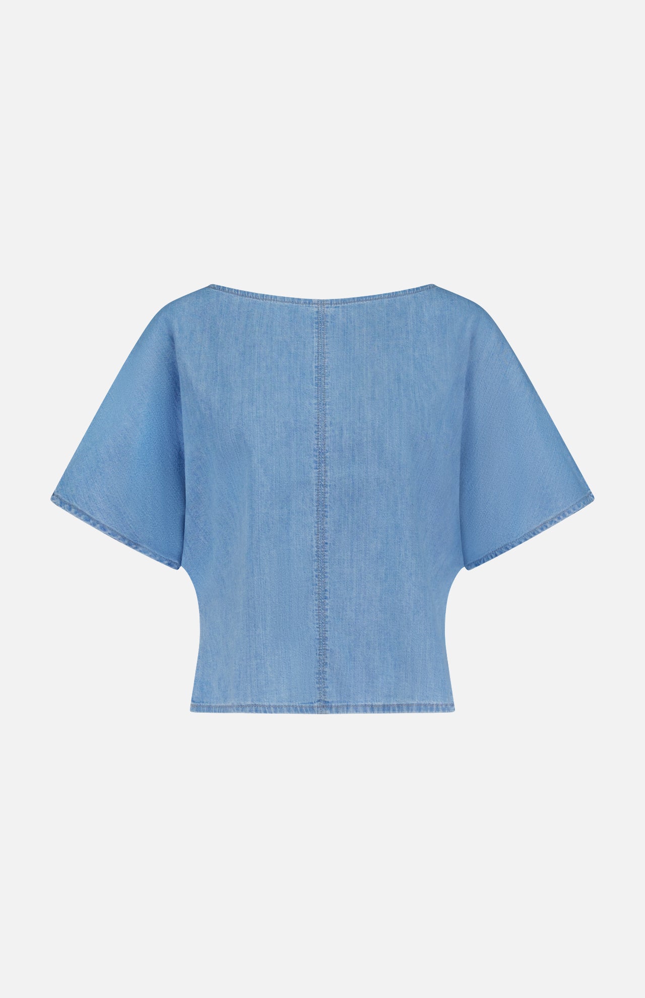 The Simple T Top by TWP is a light blue, lightweight denim tee with a relaxed fit, wide sleeves, and visible center and edge stitching. Shown from the back against a plain white background.