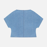 The Simple T Top by TWP is a lightweight, light blue denim shirt with wide sleeves and a relaxed, boxy cropped fit. Visible center and edge stitching add detail—ideal for effortless women’s workwear. Shown flat on a white background.